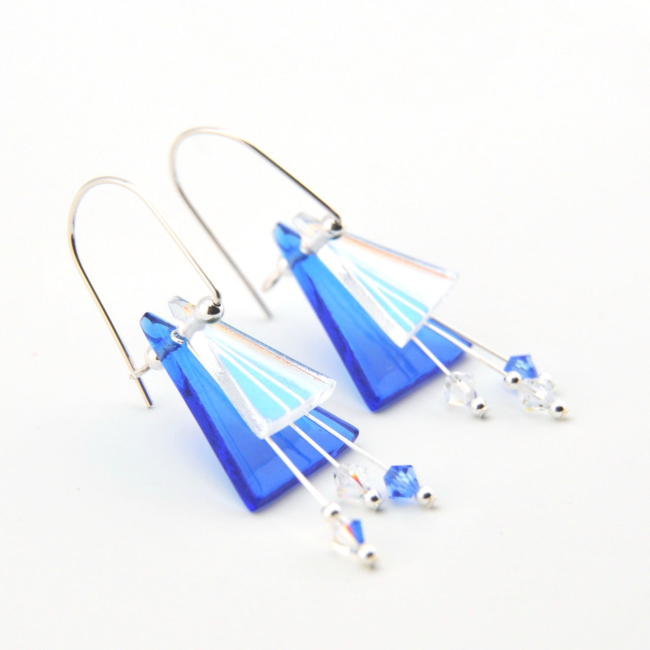 Blue and silver earrings on a white background
