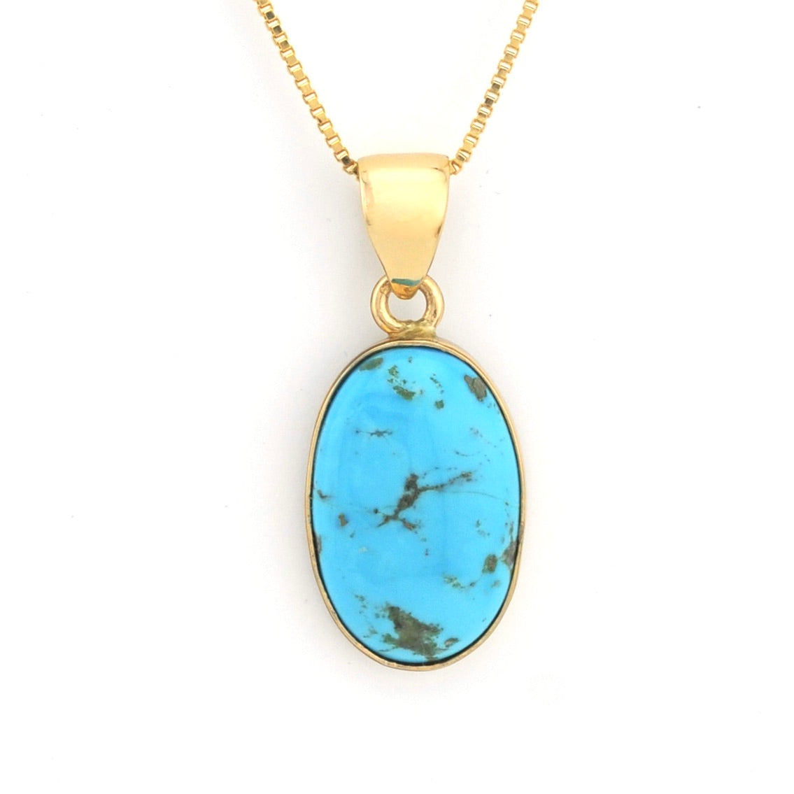 Gold necklace with a turquoise pendant on a white background