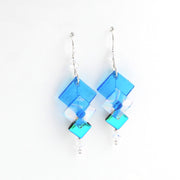 Blue square-shaped earrings on a white background