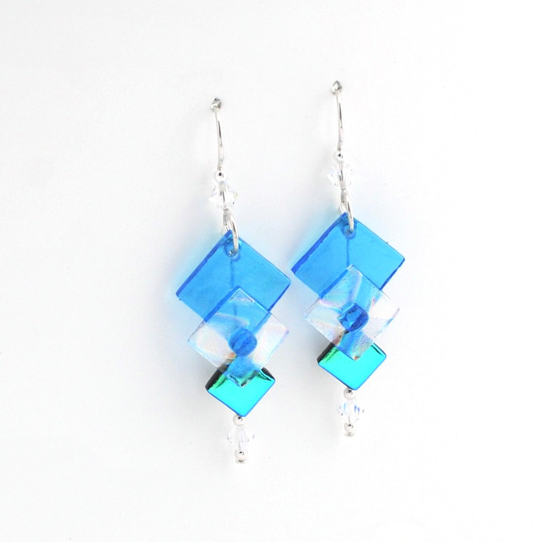 Blue square-shaped earrings on a white background