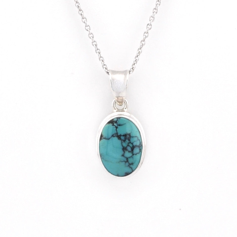 Turquoise pendant necklace on a white background