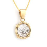 Gold pendant with a circular design on a white background