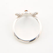 Silver ring with a small gemstone on a white background