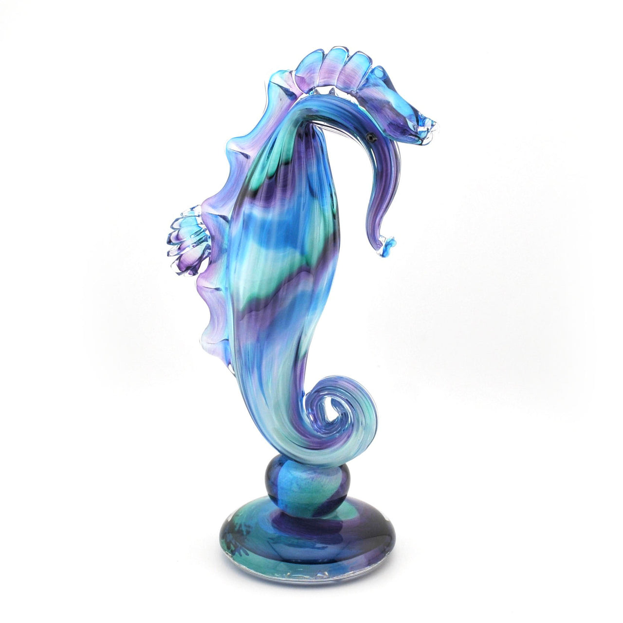 Colorful glass seahorse figurine on a white background