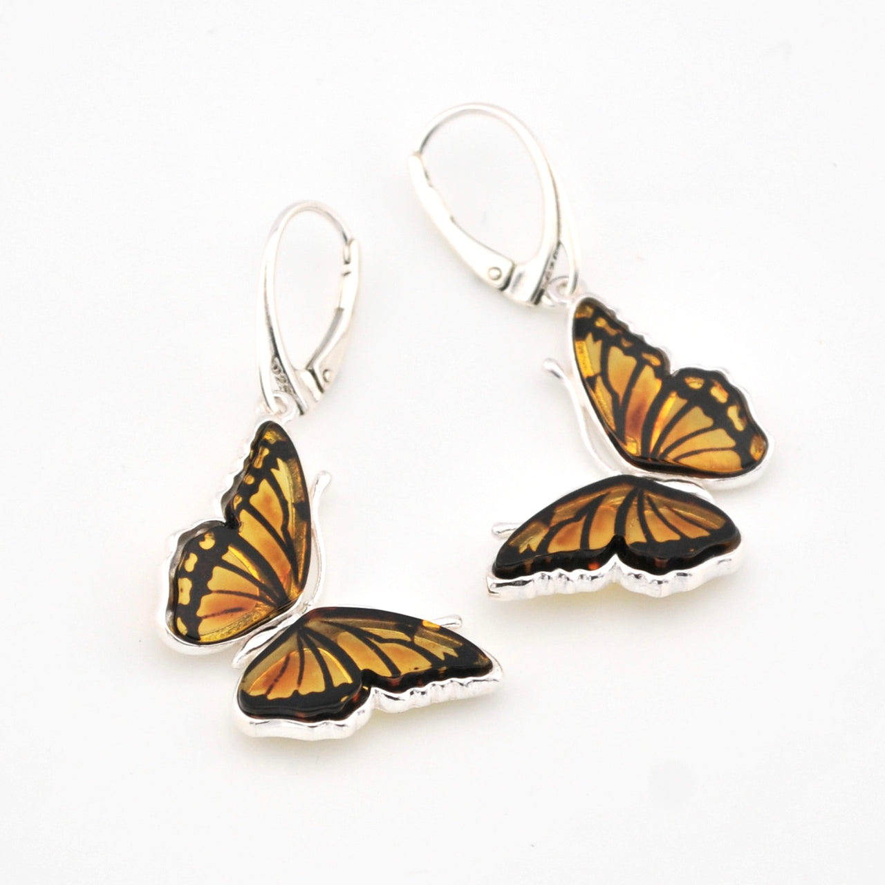 Butterfly-shaped earrings on a white background