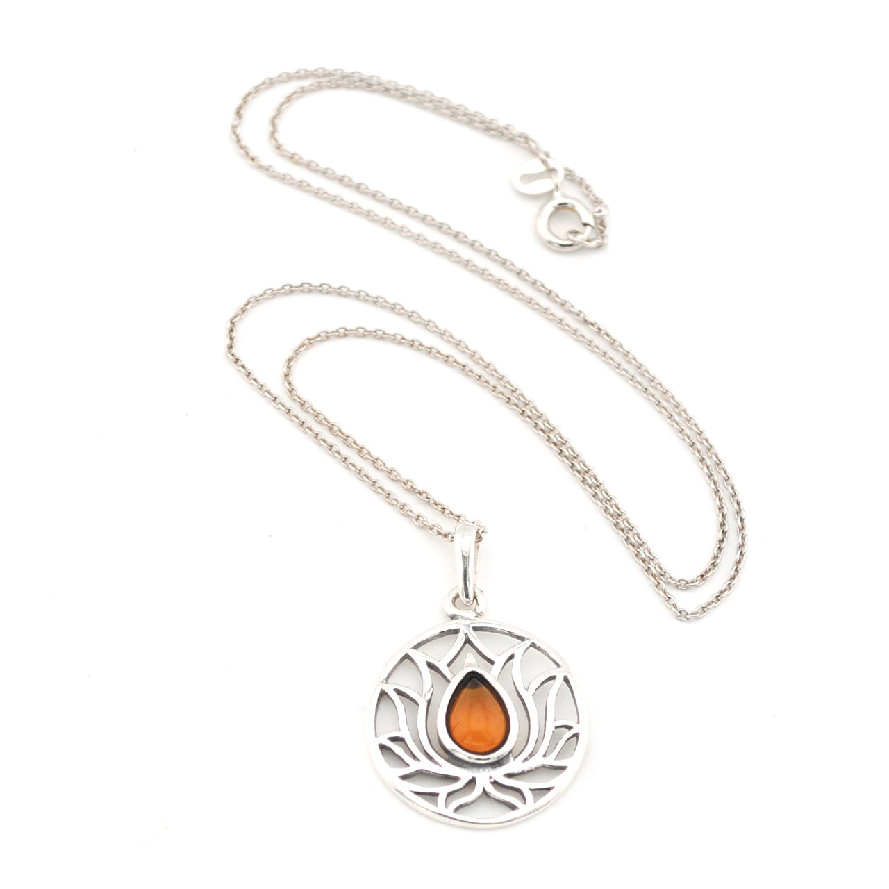 Silver necklace with a circular pendant featuring an orange stone on a white background