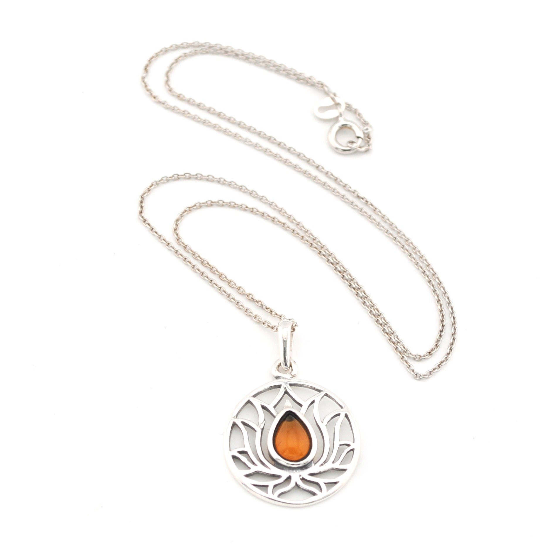 Silver necklace with a circular pendant featuring an orange stone on a white background