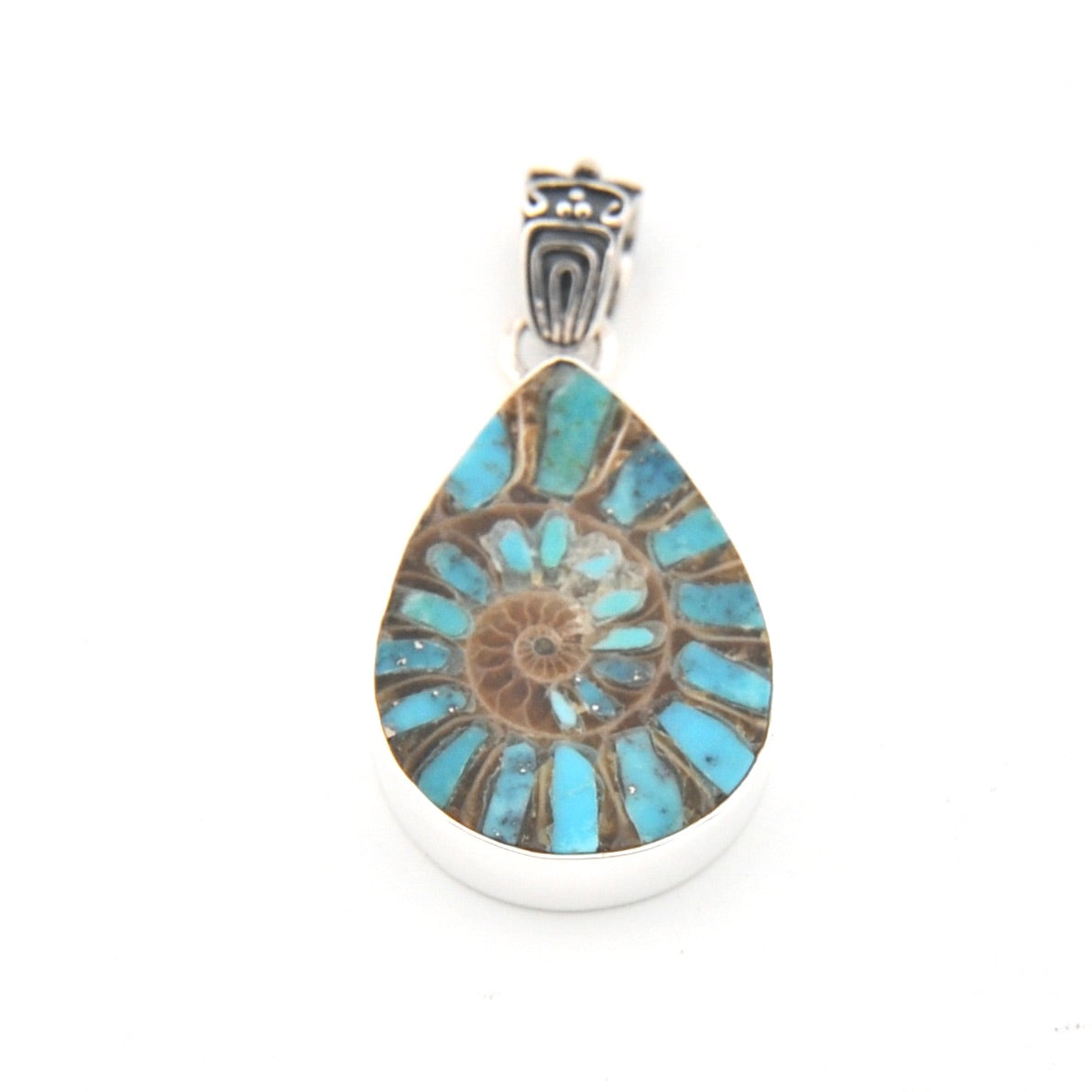 Teardrop-shaped pendant with floral design and silver setting on a white background