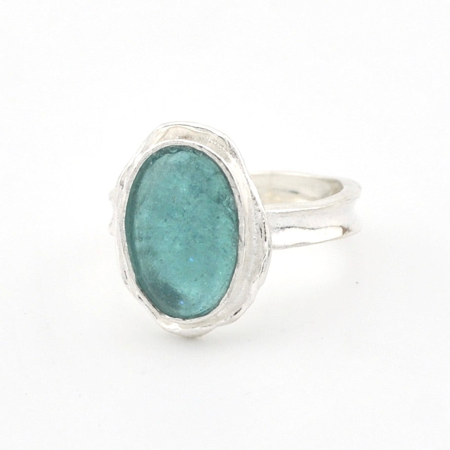 Silver ring with a Roman Glass on a white background