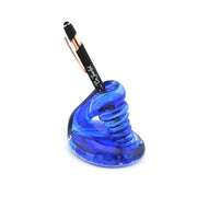 Blue glass pen holder with a black pen on a white background