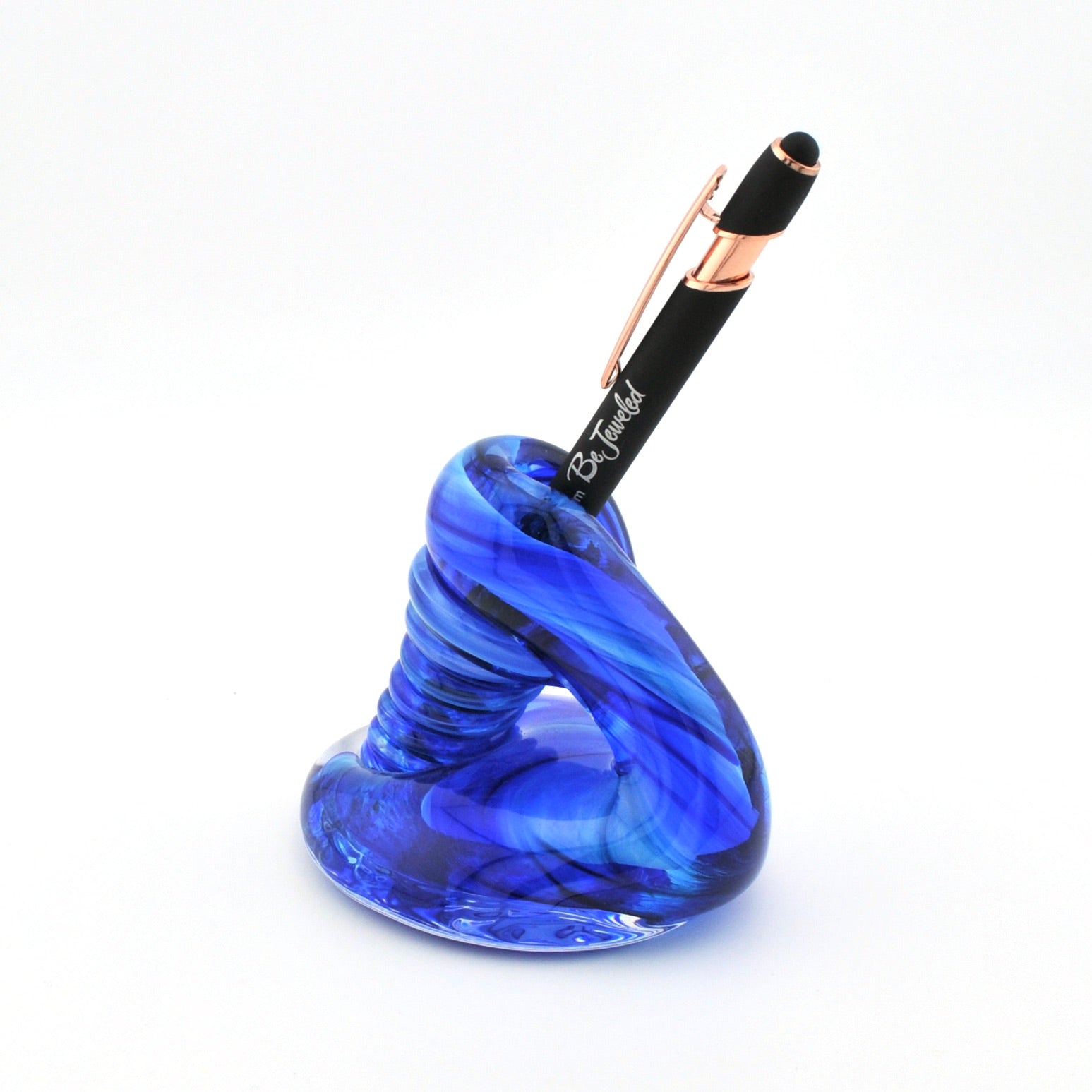 Blue glass pen holder with a black pen on a white background