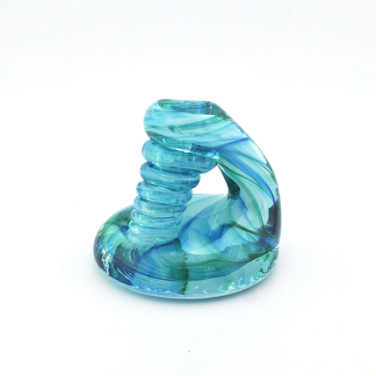 Blue and green glass spiral object on a white background