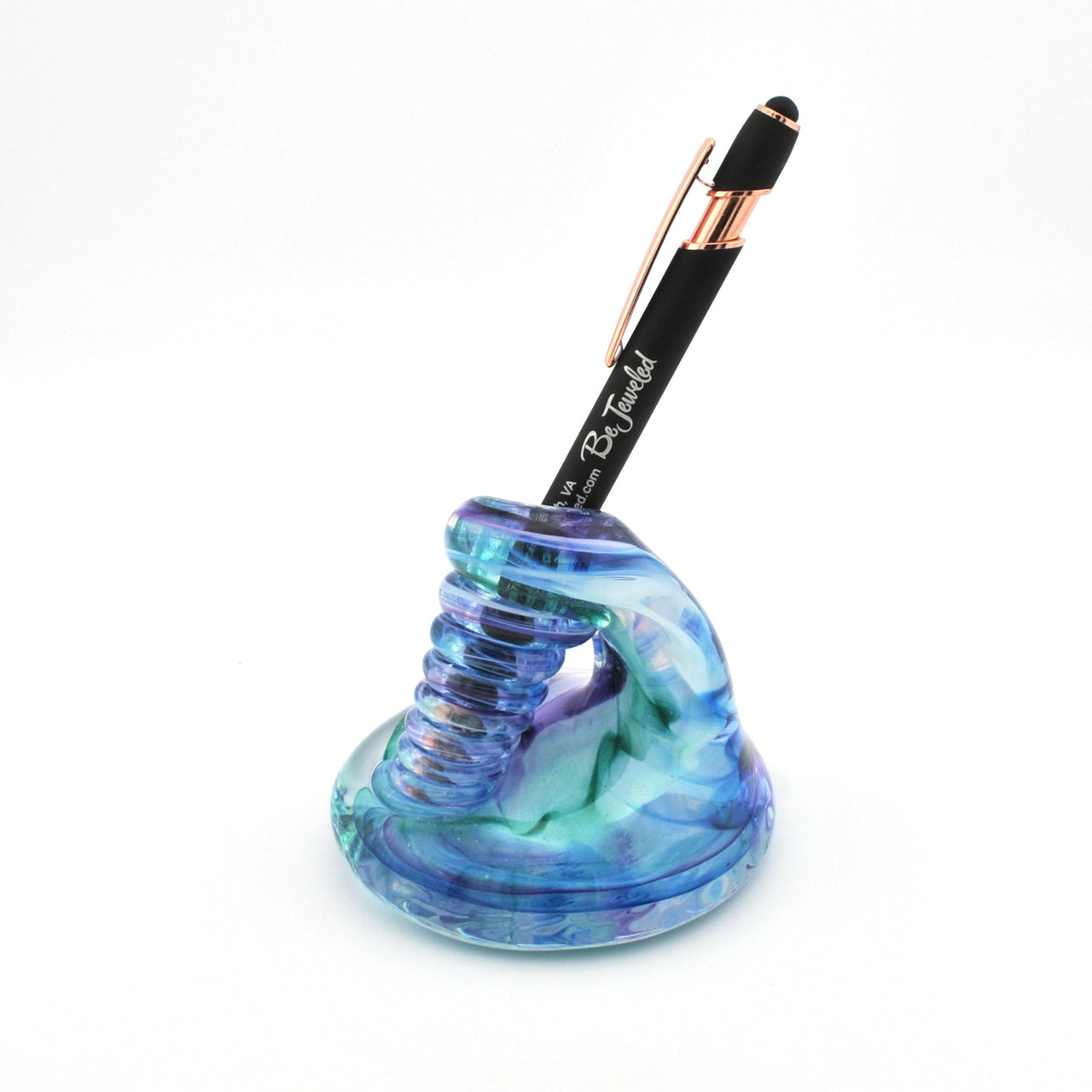 Colorful glass pen holder with a pen on a white background