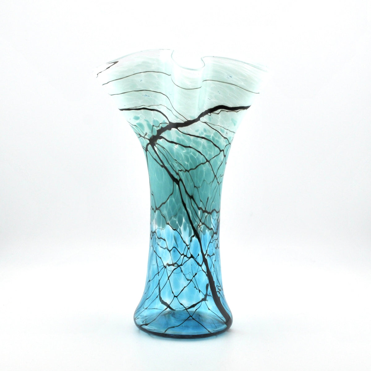 A hand-blown glass vase with a flared rim, featuring a color gradient from light aqua at the top to vibrant blue at the base, decorated with a black branch-like web pattern.