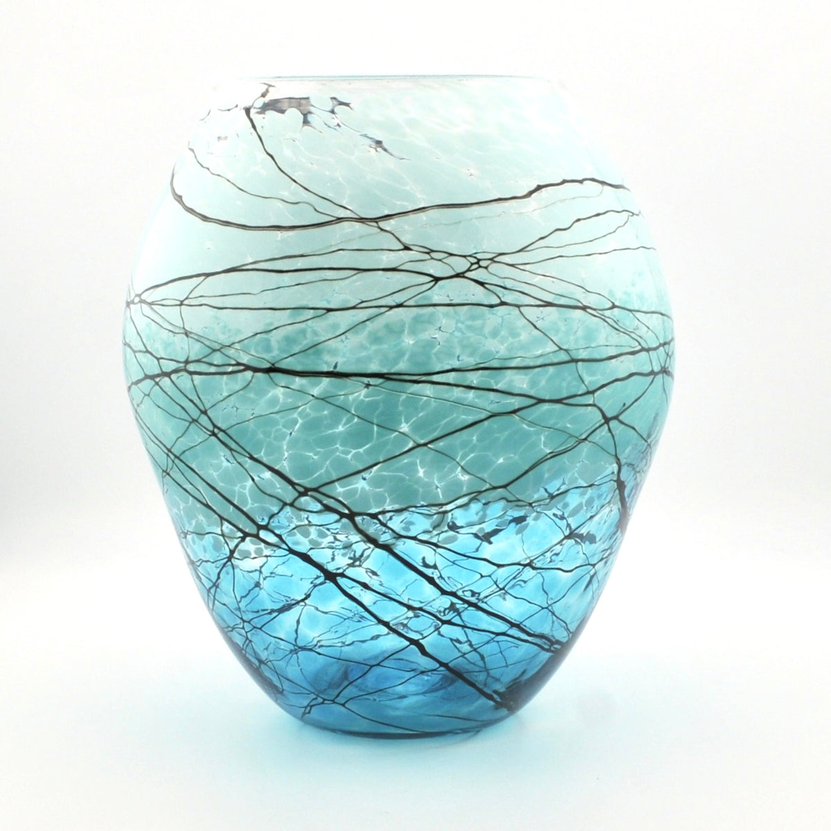 A decorative glass vase with a rounded, bulbous shape, featuring a light blue to white gradient with a network of dark, branching crack-like lines across the surface.