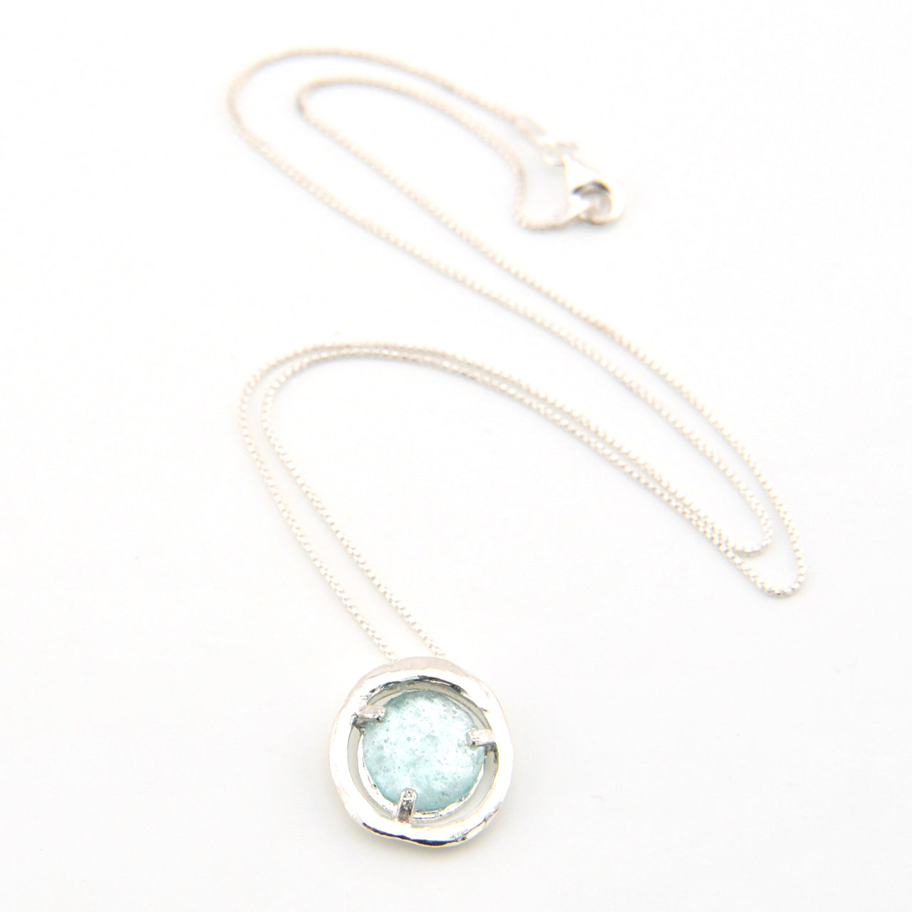 Necklace with a round pendant on a white background