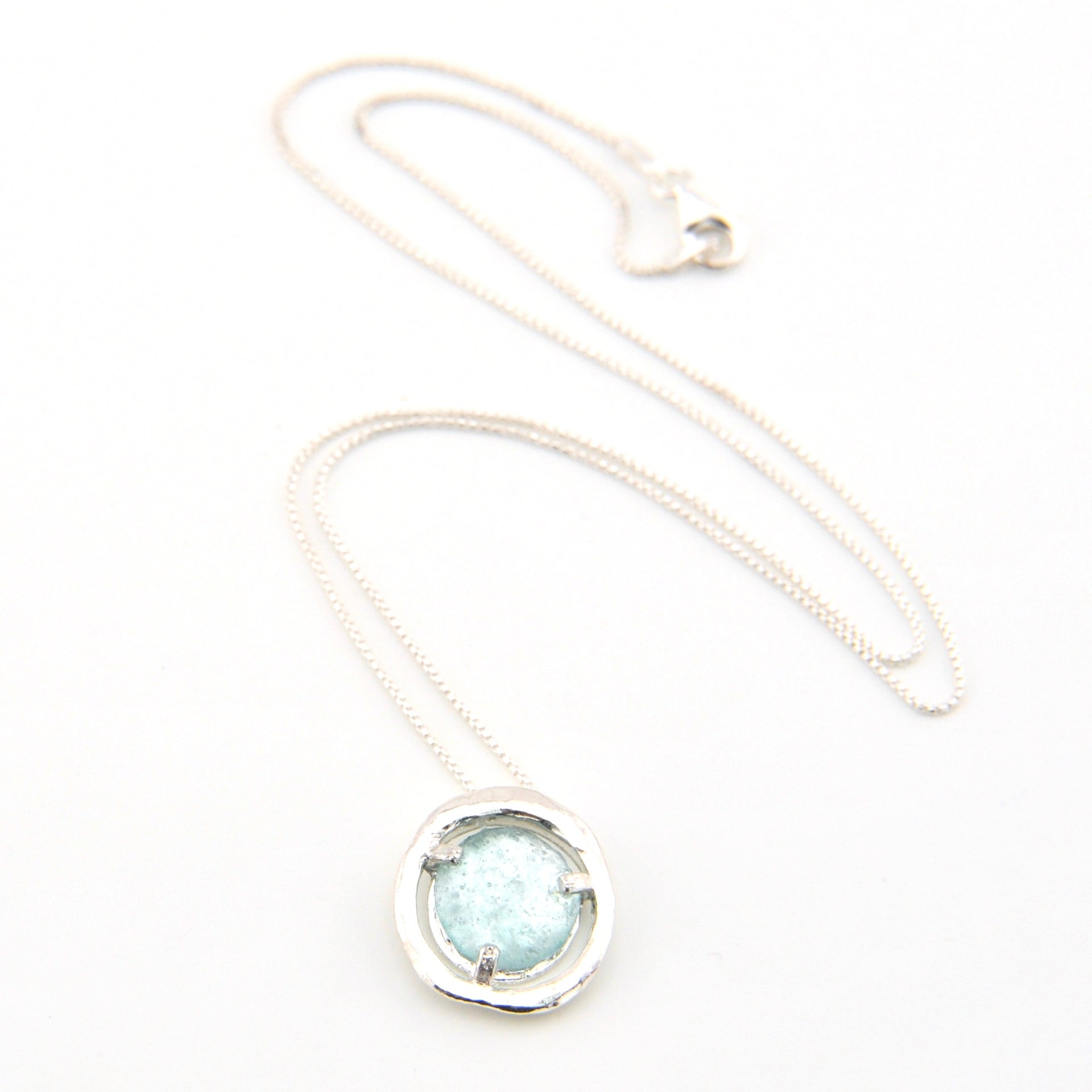 Necklace with a round pendant on a white background