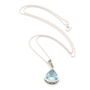 Necklace with a teardrop-shaped blue gemstone pendant on a white background