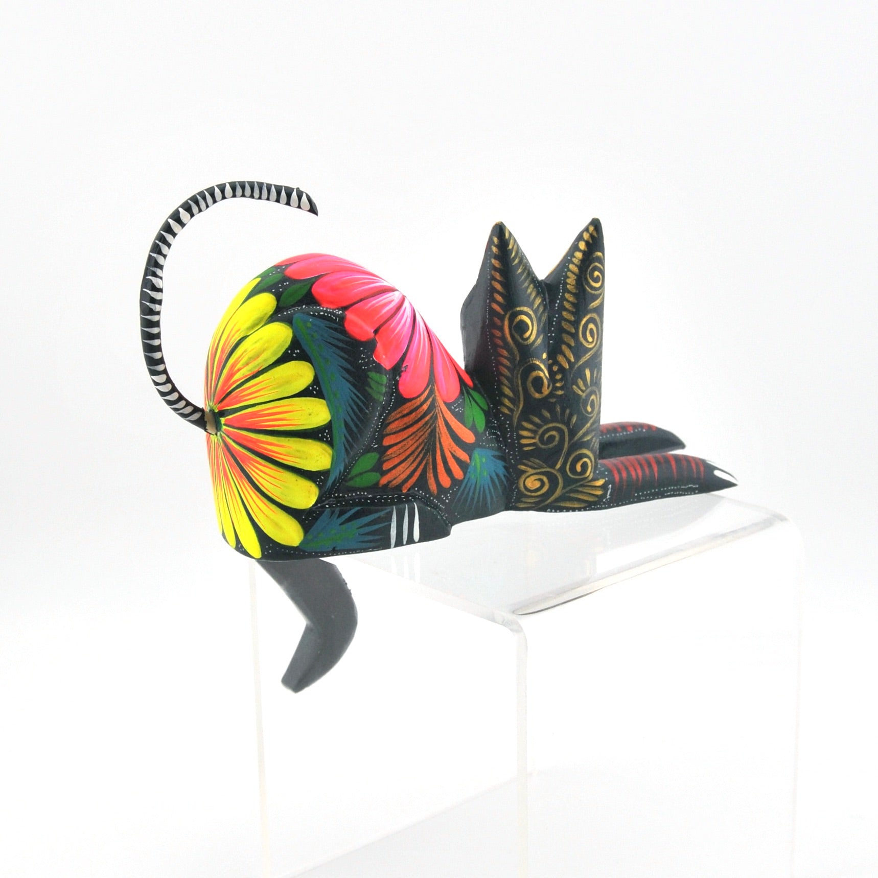 Colorful cat-shaped object on a white background