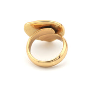 Gold ring with a white stone on a white background