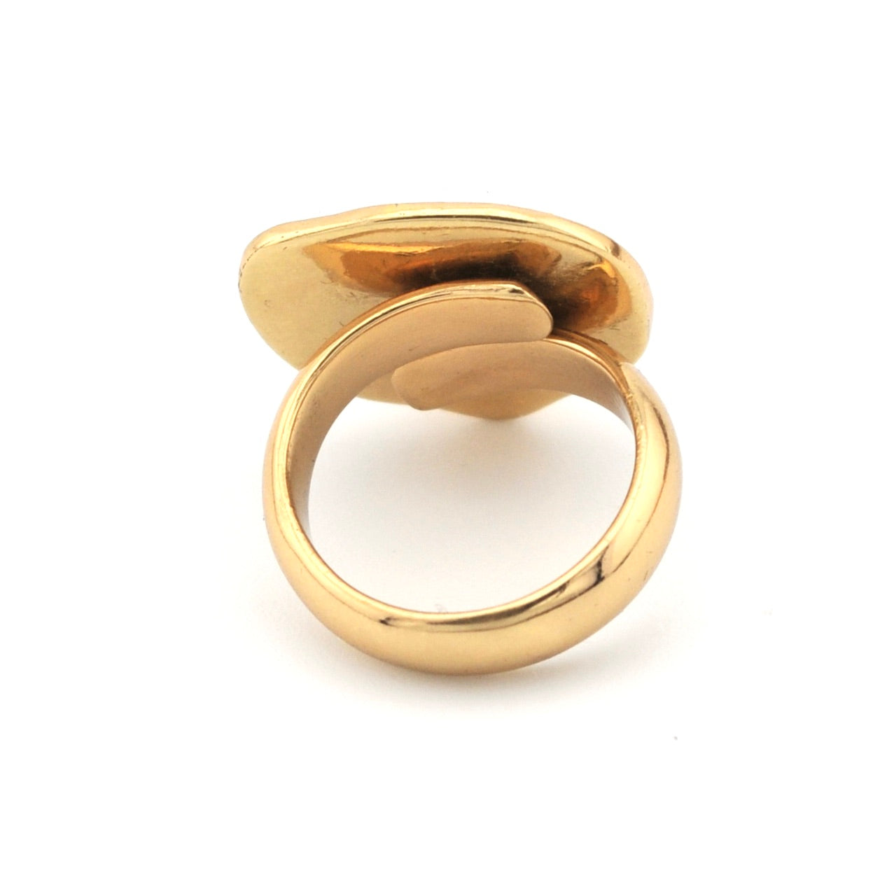 Gold ring with a white stone on a white background