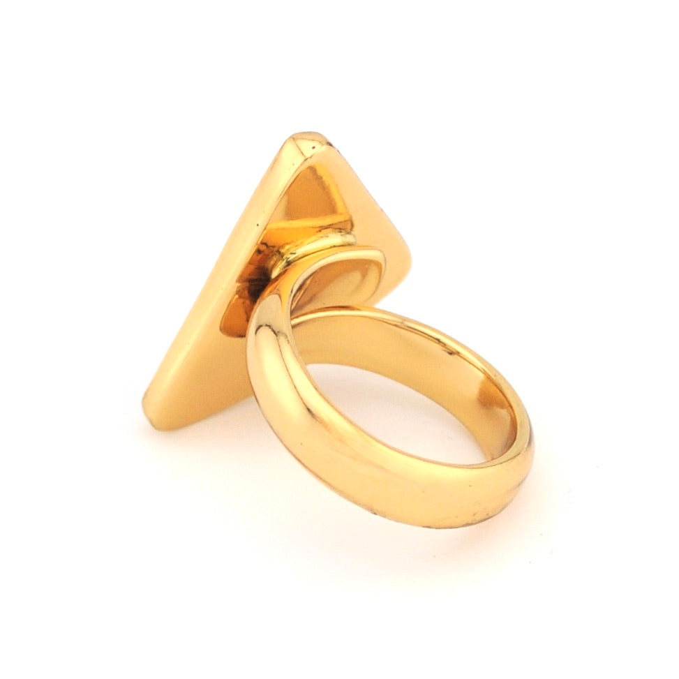 Gold ring with a unique triangular design on a white background