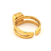 Gold ring with a unique design on a white background