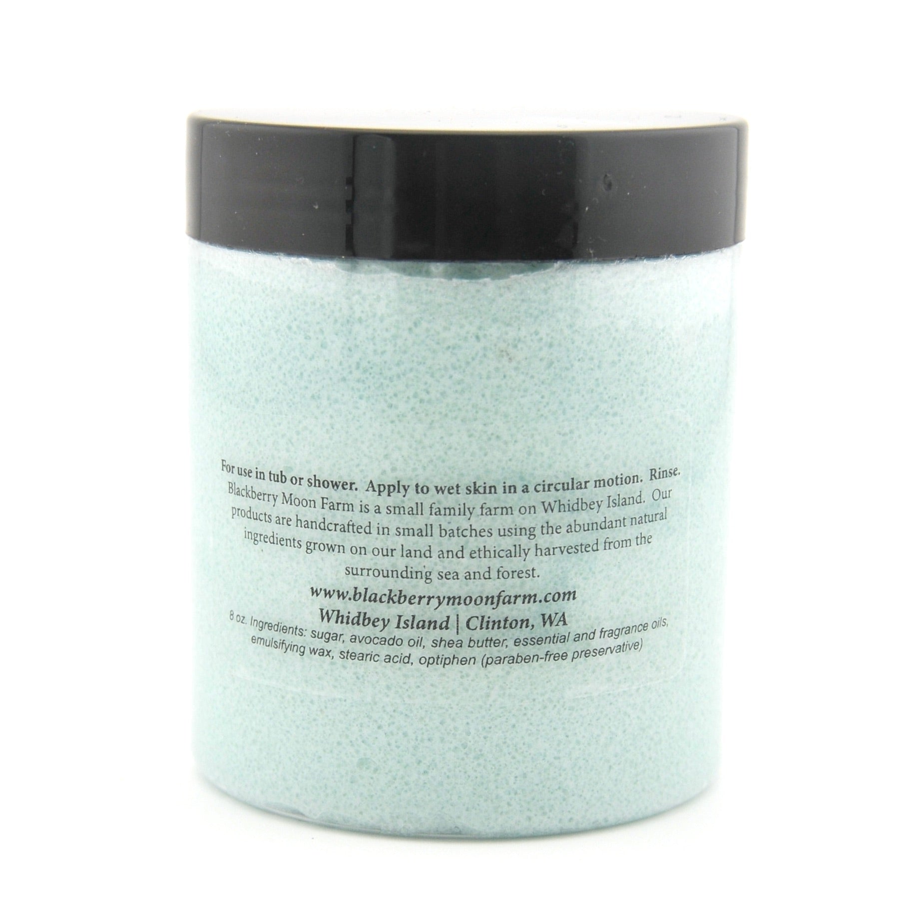 Jar of bath scrubwith a black lid on a white background