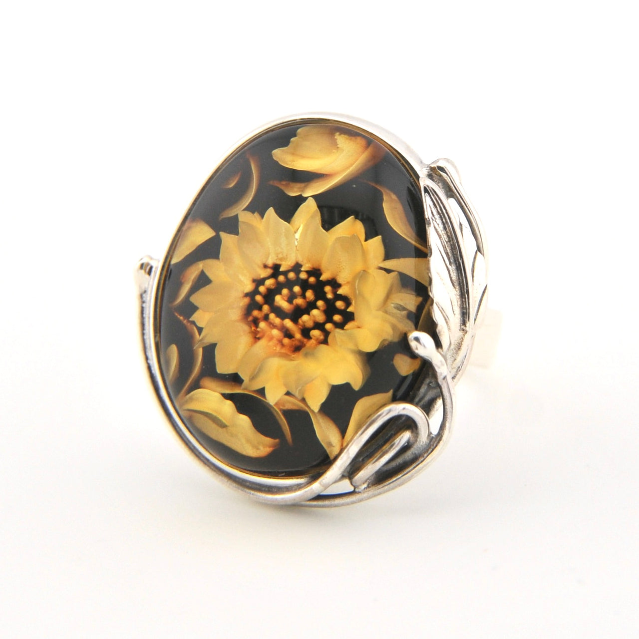 Ring with sunflower design on a black background