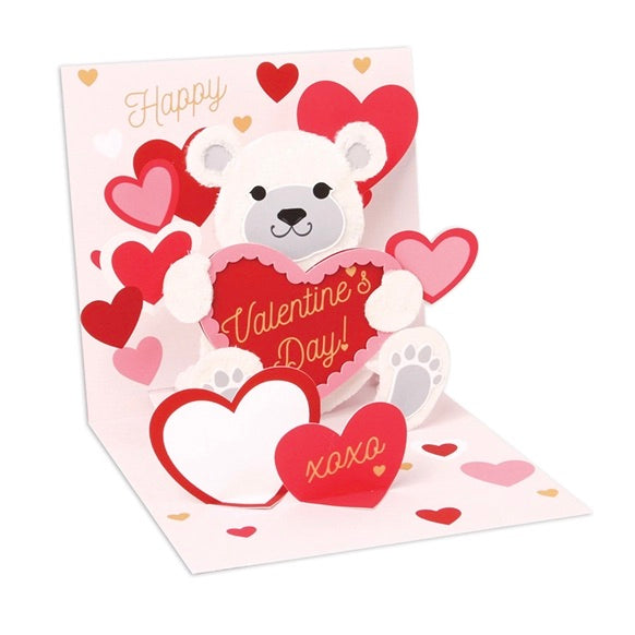 Valentine's Day card with a bear holding a heart and surrounded by hearts on a white background