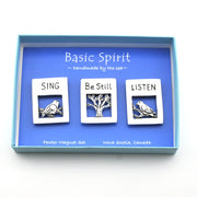 Three magnets featuring birds with the words sing, be still and listen in blue box on a white background.