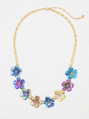 Multicolored floral necklace on a white background