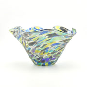 Multicolored glass bowl on a white background