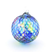 Multicolored glass ornament on a white background