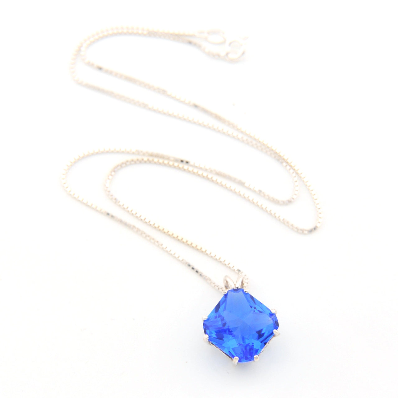 Necklace with a blue pendant on a white background
