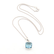 Necklace with a blue gemstone pendant on a white background