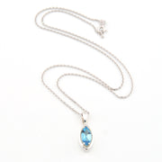 Silver necklace with a blue gemstone pendant on a white background