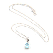 Necklace with a teardrop-shaped blue gemstone pendant on a white background