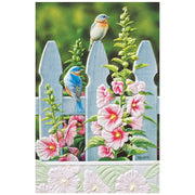 Two blue birds on a white picket fence with pink flowers