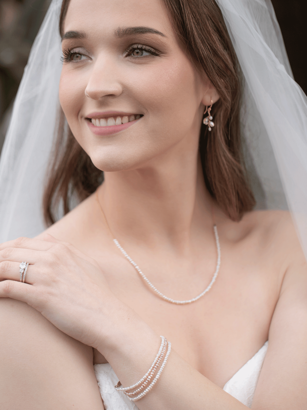 Model wearing blush pearl bracelet