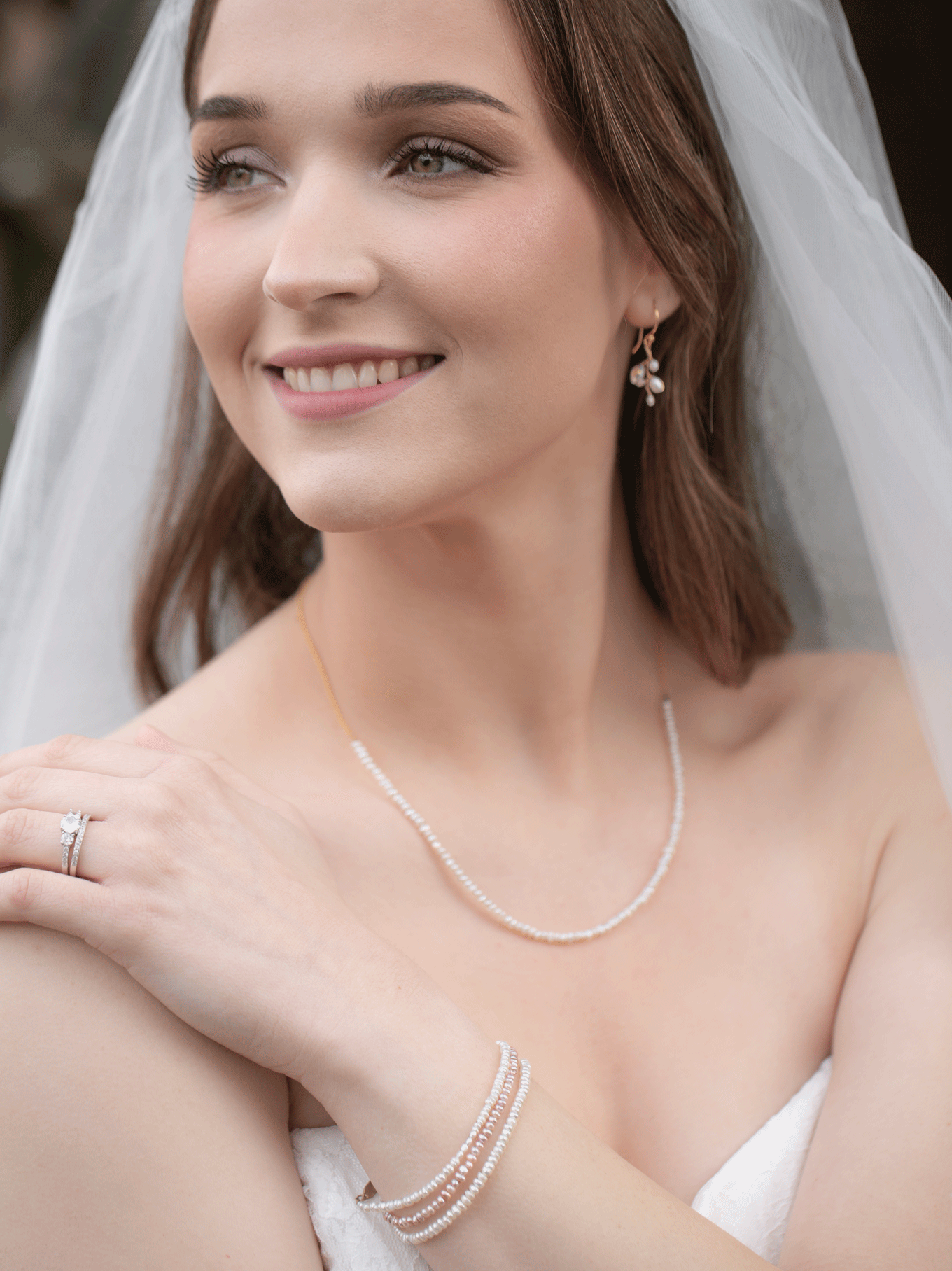 Model wearing blush pearl bracelet