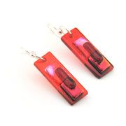 Rectangular red and black earrings on a white background