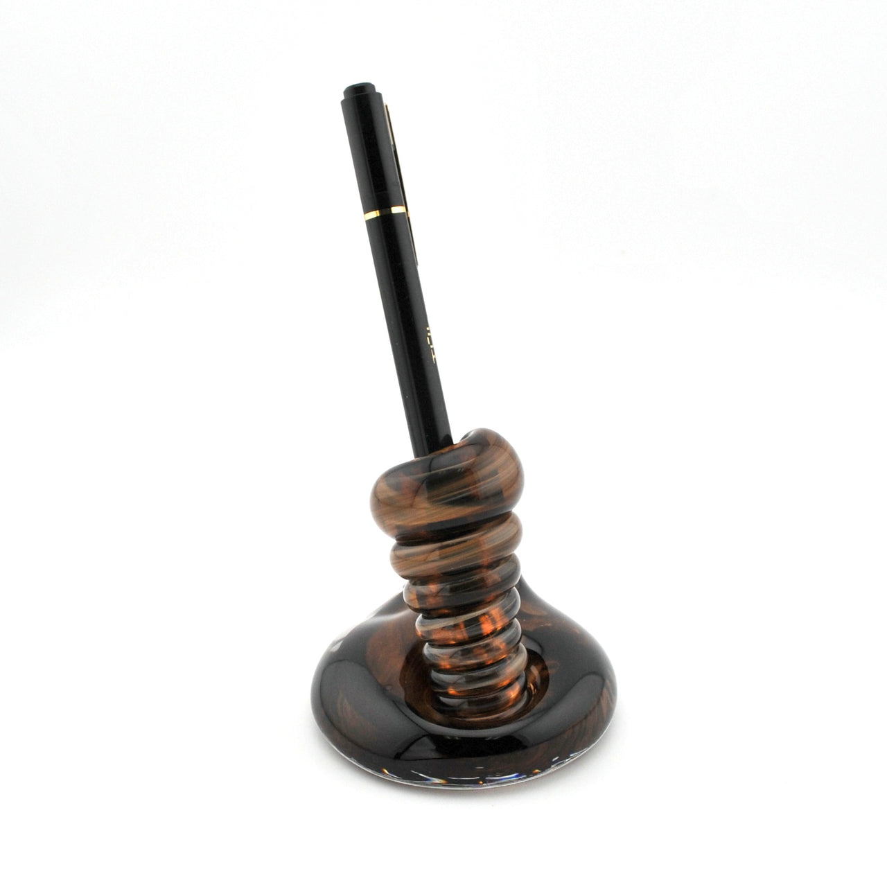 Decorative pen holder with a brown pen on a white background