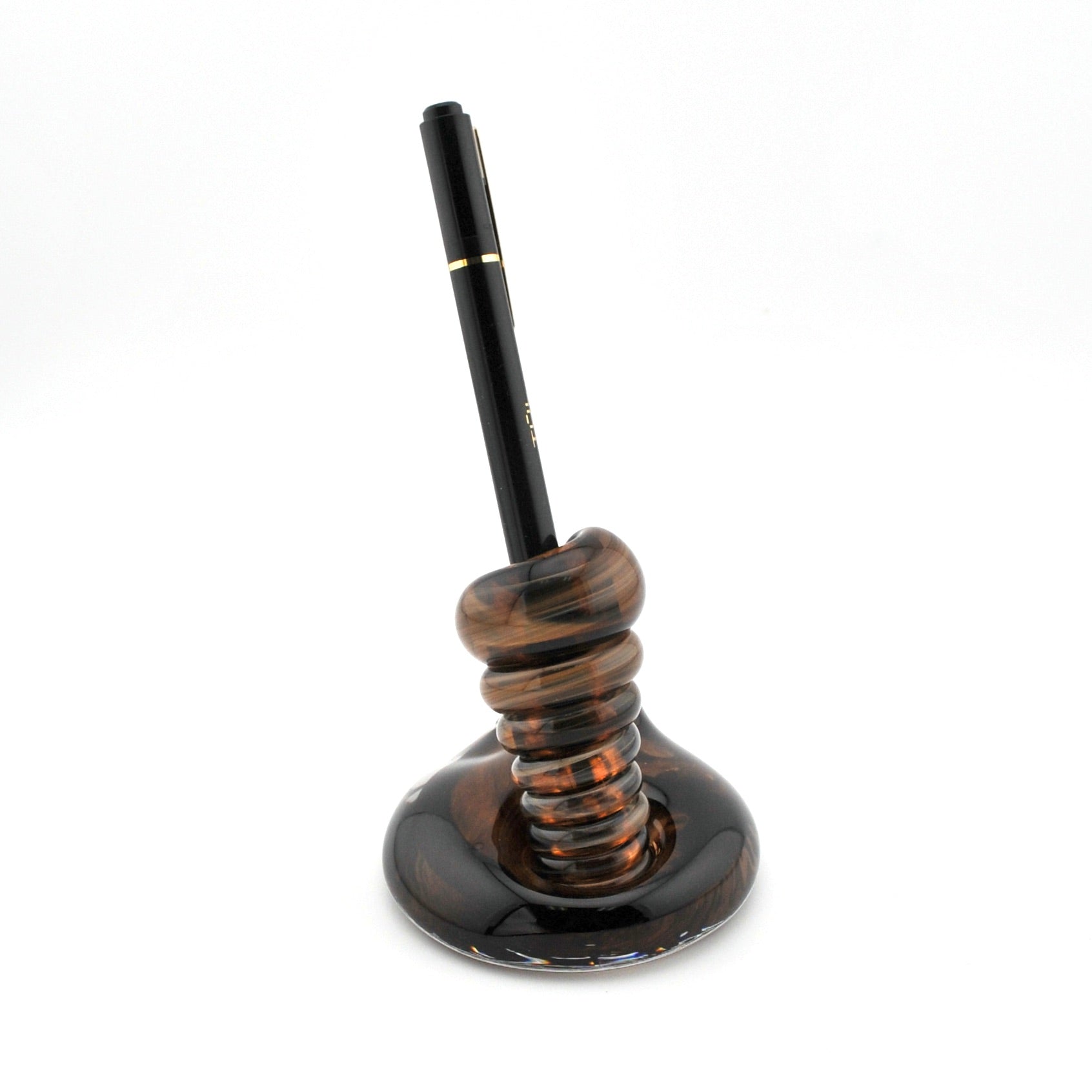Decorative pen holder with a brown pen on a white background