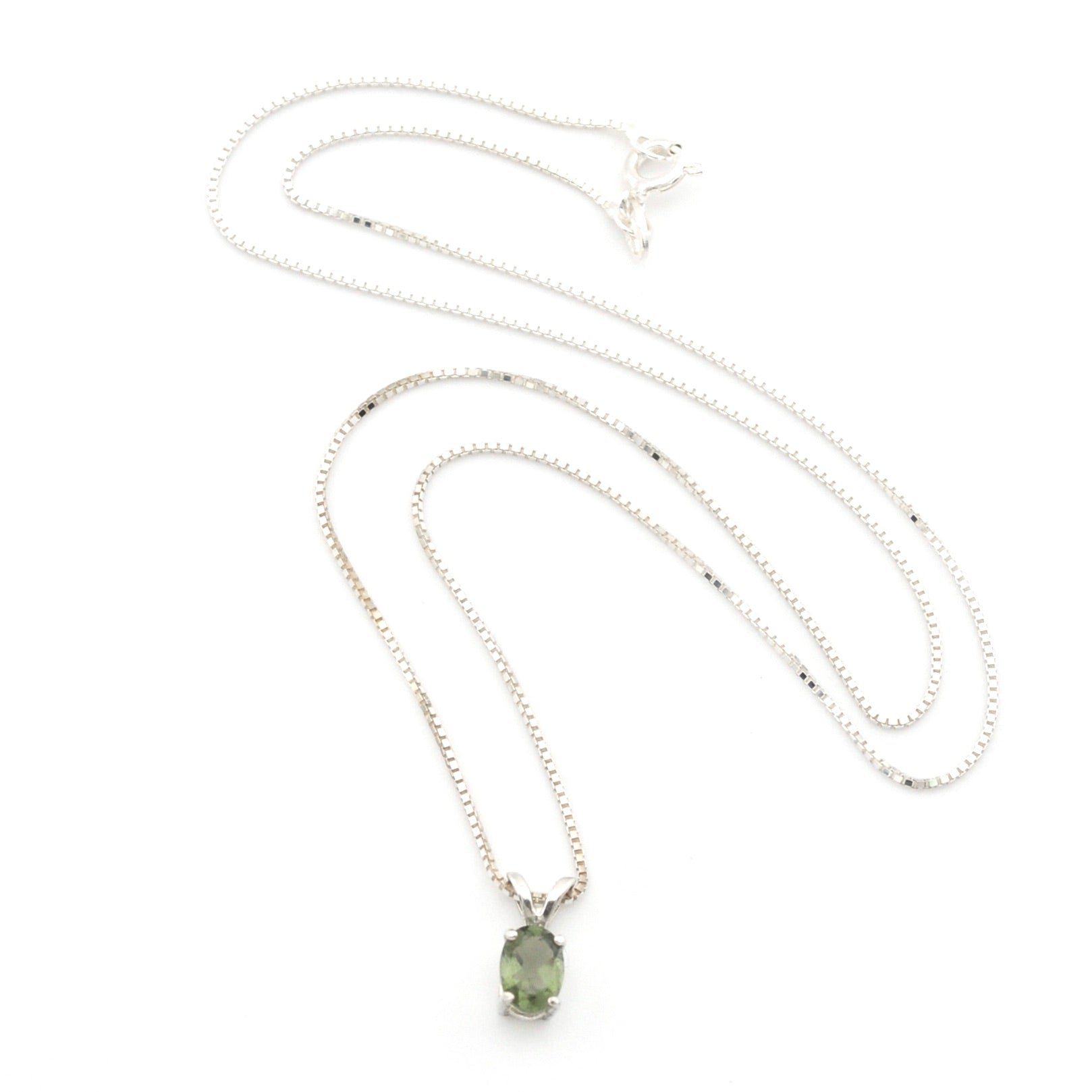 A silver chain necklace with a small oval green gemstone pendant, displayed on a clean white background.