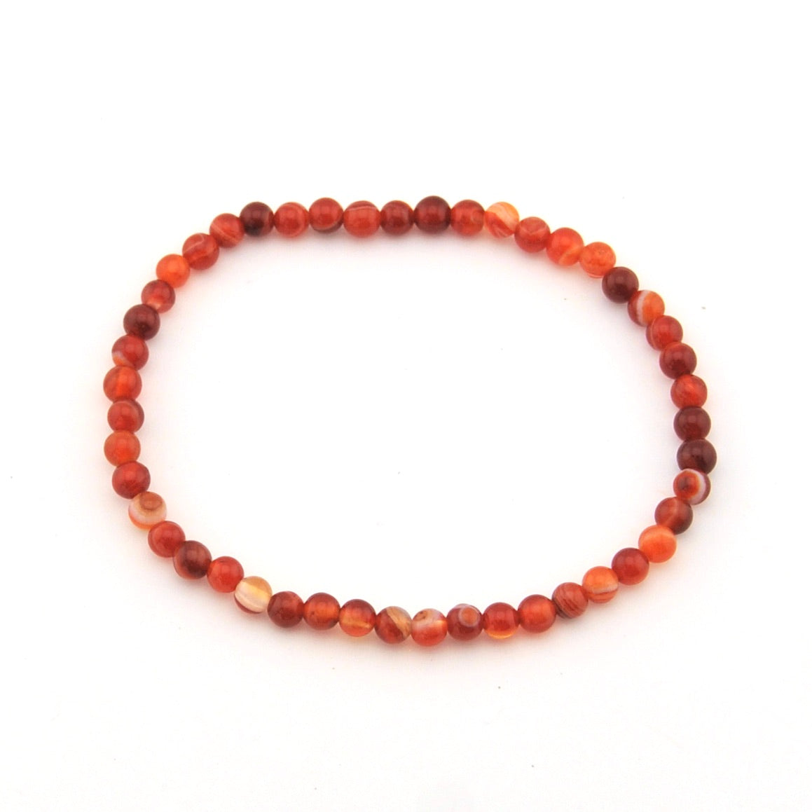 Beaded bracelet with red and orange beads on a white background