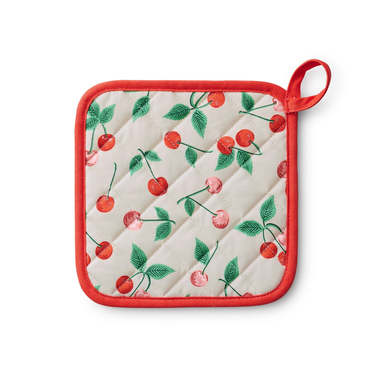 Quilted pot holder with cherry pattern on a white background