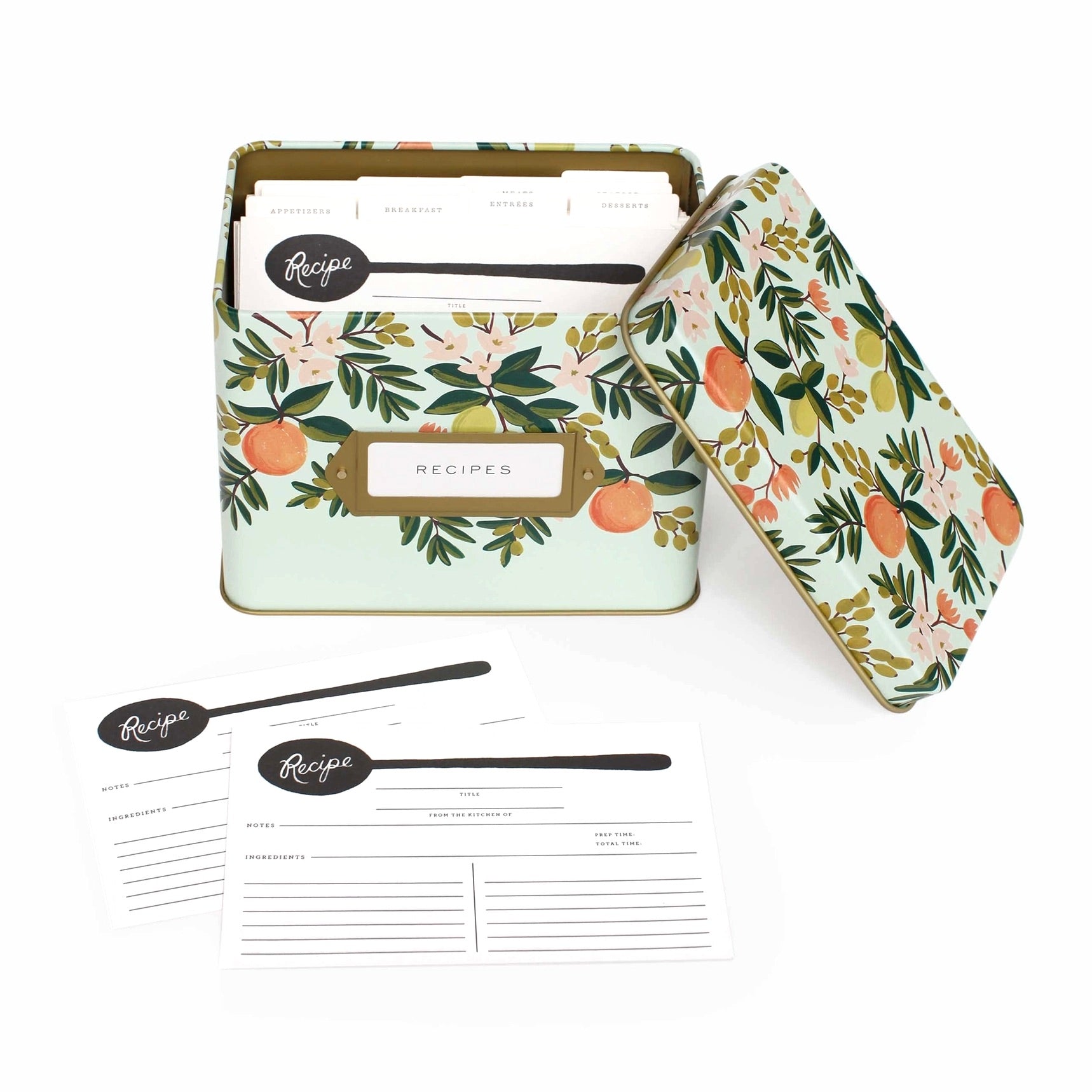 Floral-patterned recipe box with recipe cards and spoons on a white background