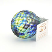 Colorful glass sphere with a tag on a white background