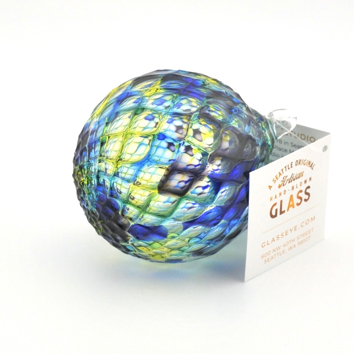 Colorful glass sphere with a tag on a white background